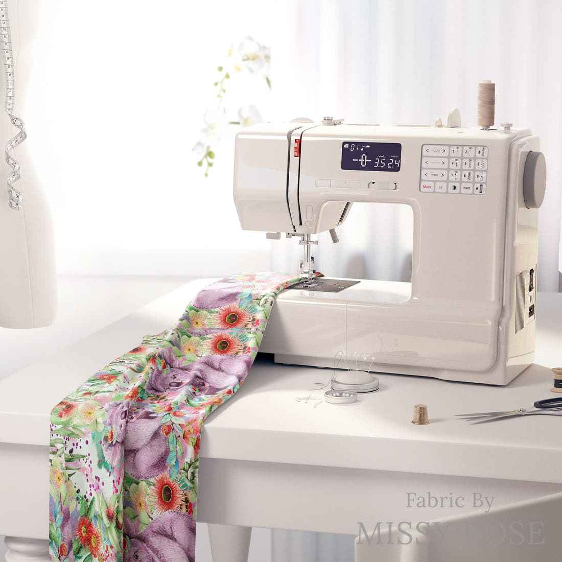 Design 1002 Green Koala Fabric on a sewing machine – premium fabric for sewing projects | Fabric by Missy Rose