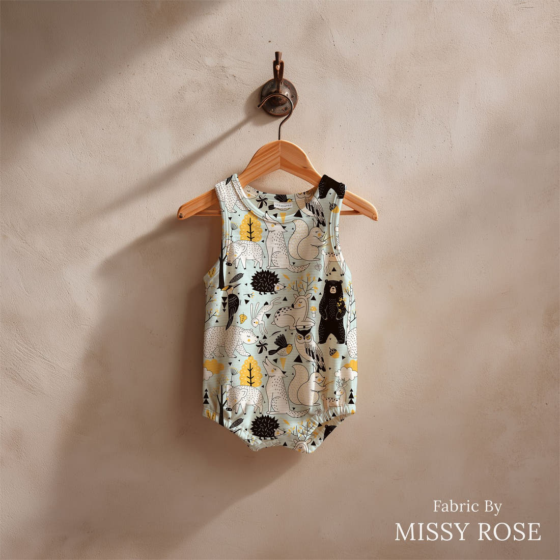 Design 1012 Scandi Woodlands Fabric sewn into a baby romper – see how the print looks made up | Fabric by Missy Rose