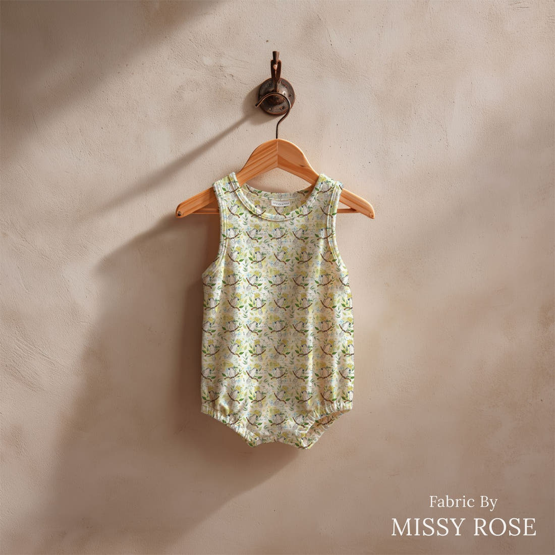 Design 1017 Cockatoo Fabric sewn into a baby romper – see how the print looks made up | Fabric by Missy Rose