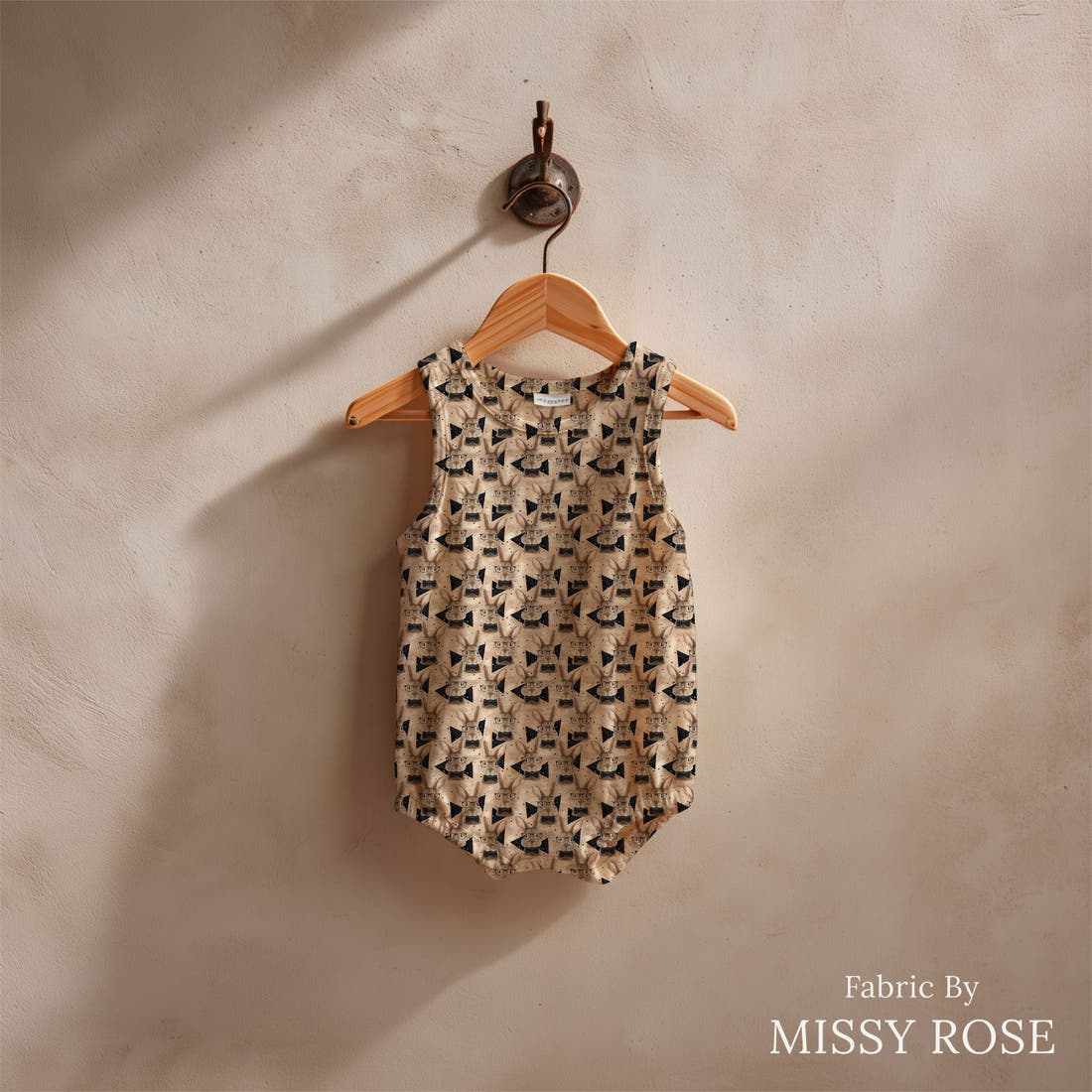 Design 1034 Neutral Bunny Fabric sewn into a baby romper – see how the print looks made up | Fabric by Missy Rose