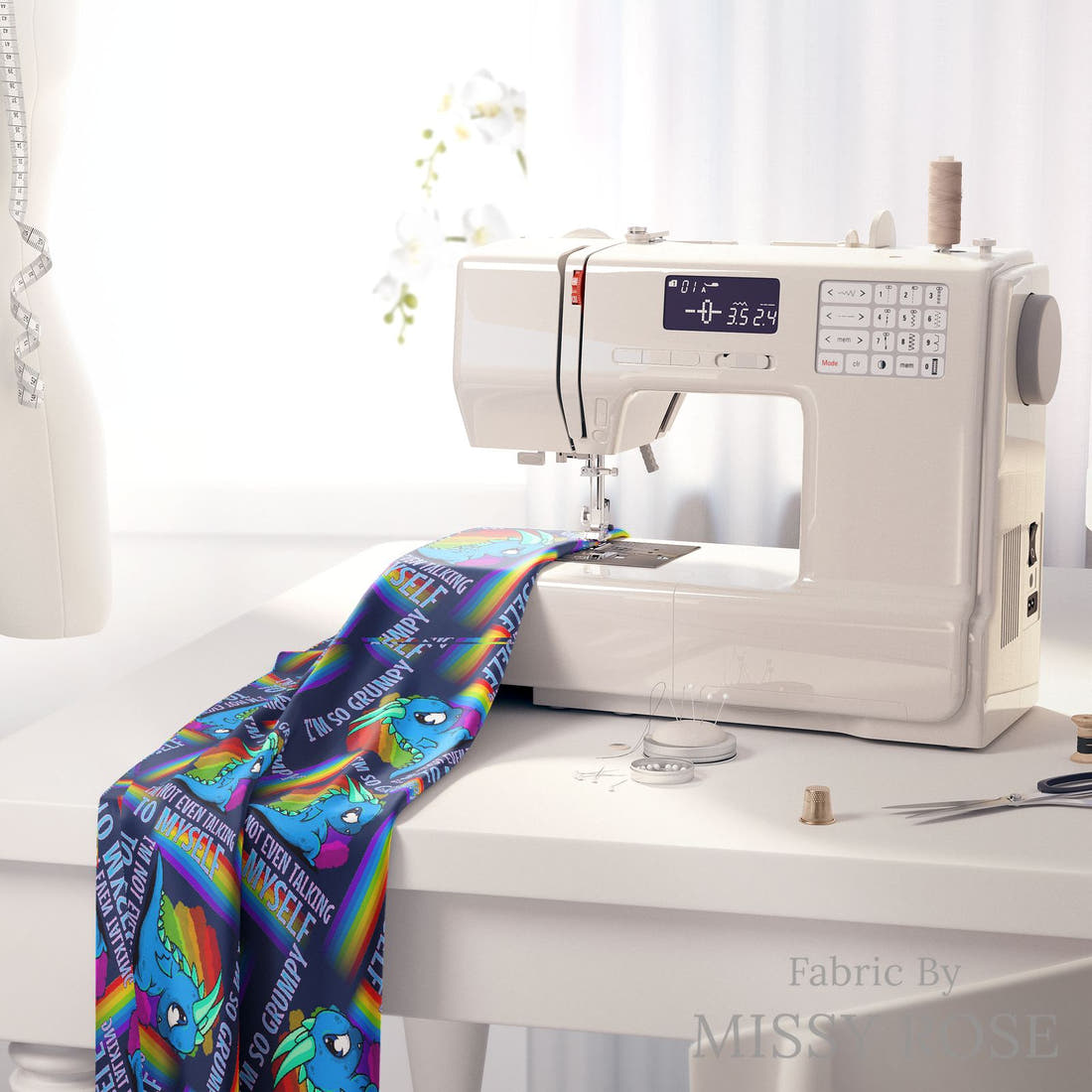 Design 104 Grumpy Dragon Fabric on a sewing machine – premium fabric for sewing projects | Fabric by Missy Rose