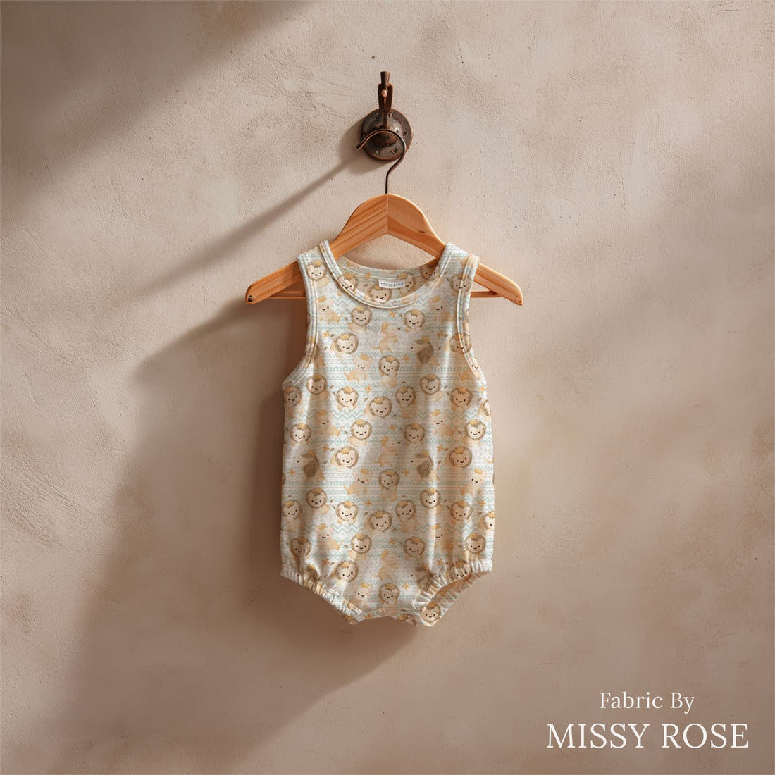 Design 1043 Lion Fabric sewn into a baby romper – see how the print looks made up | Fabric by Missy Rose