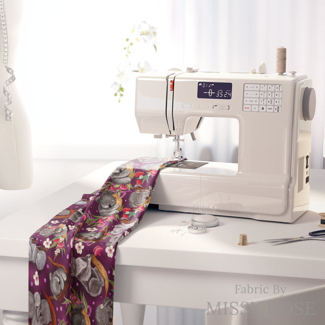 Design 1044 Floral Koala Fabric on a sewing machine – premium fabric for sewing projects | Fabric by Missy Rose