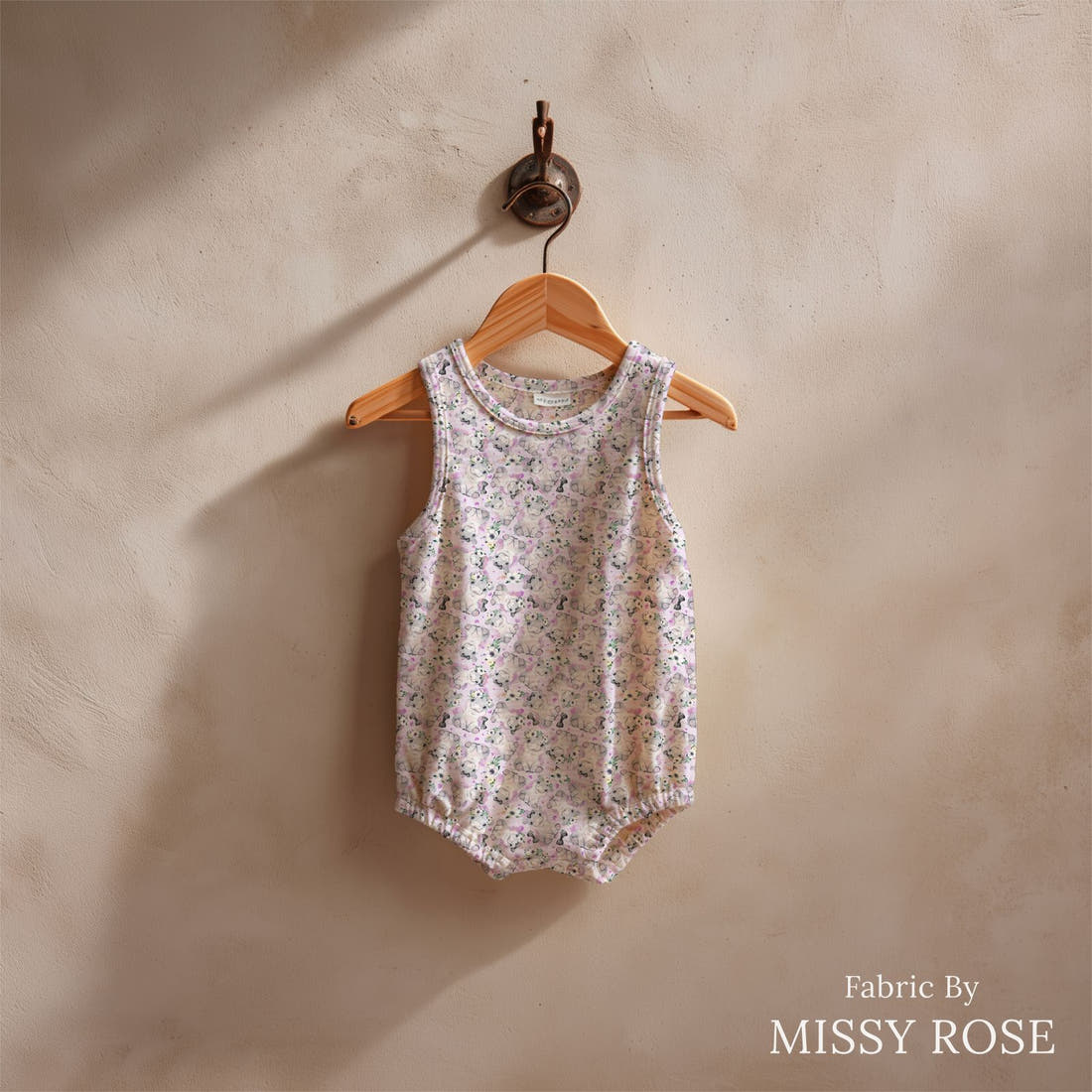 Design 1049 Purple Hippo Fabric sewn into a baby romper – see how the print looks made up | Fabric by Missy Rose