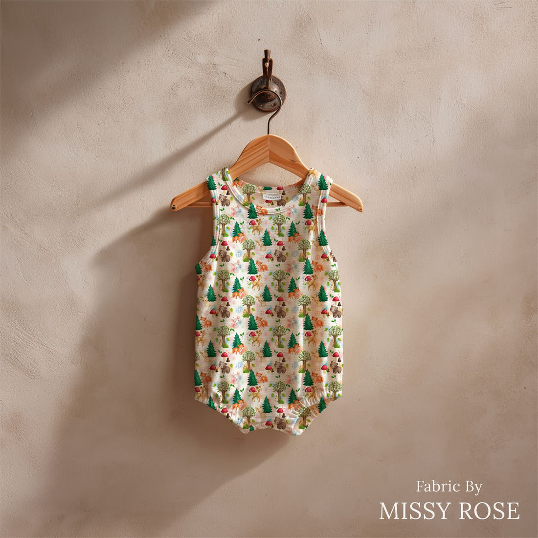 Design 1058 Woodlands Fabric sewn into a baby romper – see how the print looks made up | Fabric by Missy Rose