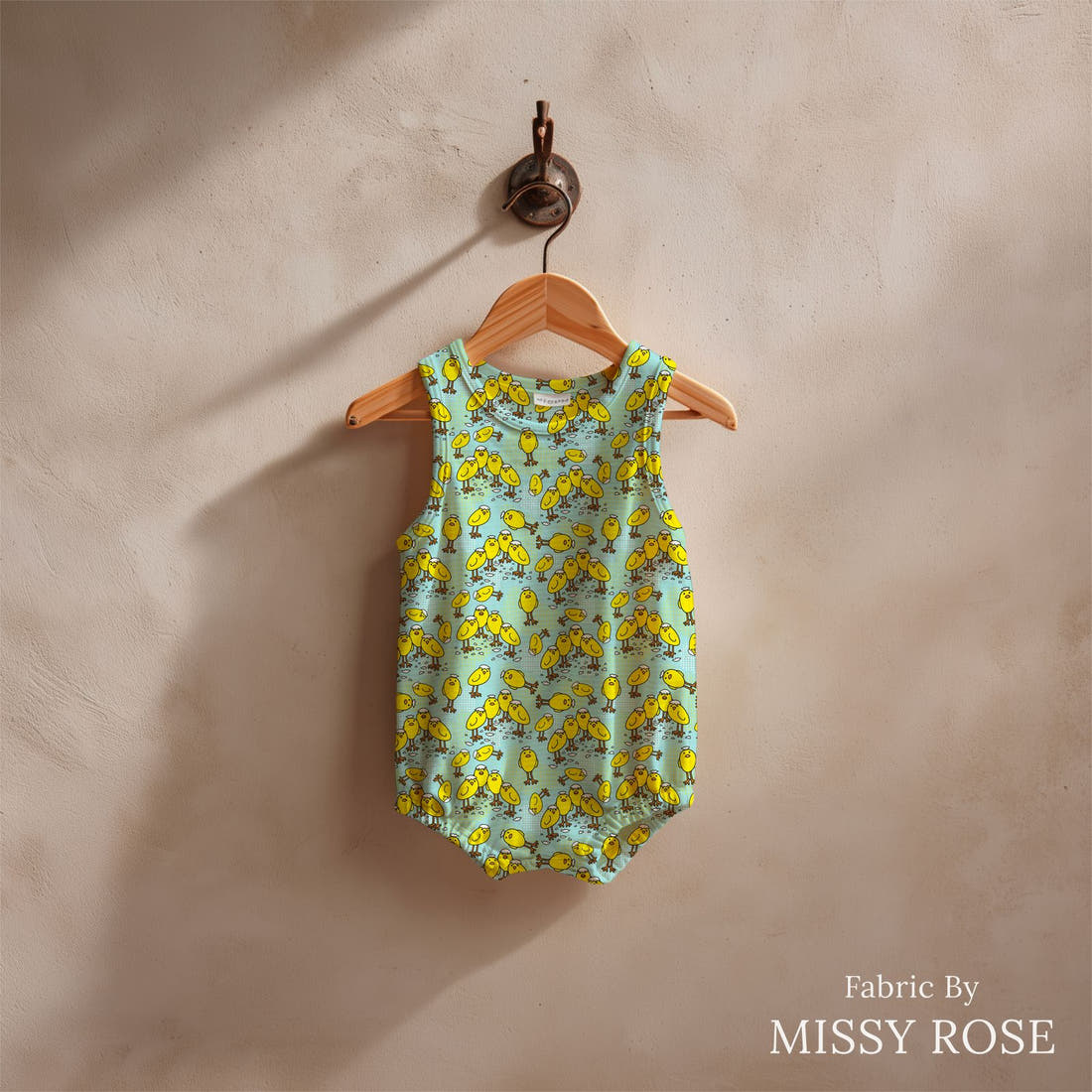 Design 1066 Chicks Fabric sewn into a baby romper – see how the print looks made up | Fabric by Missy Rose