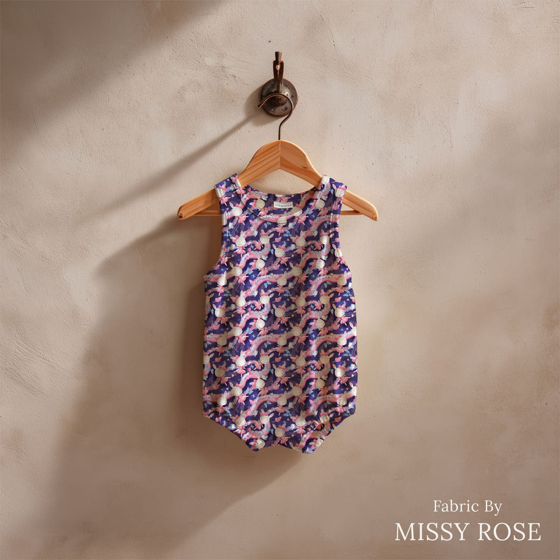 Design 1072 Navy Bunny Fabric sewn into a baby romper – see how the print looks made up | Fabric by Missy Rose