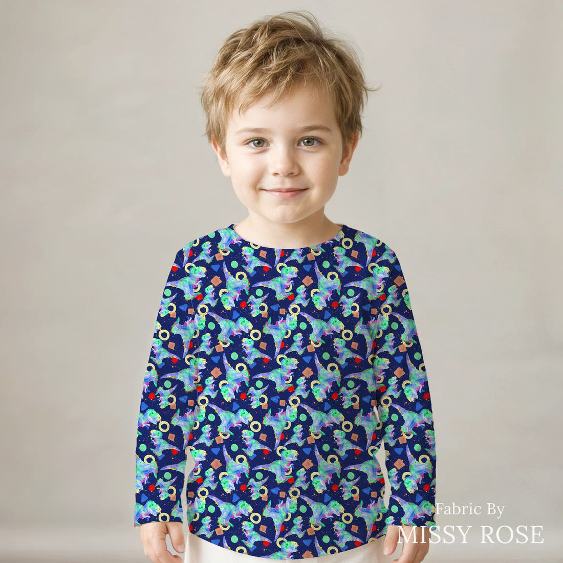 Design 1075 Watercolour Dino Fabric sewn into a kids' long sleeve top – see how the print looks made up | Fabric by Missy Rose