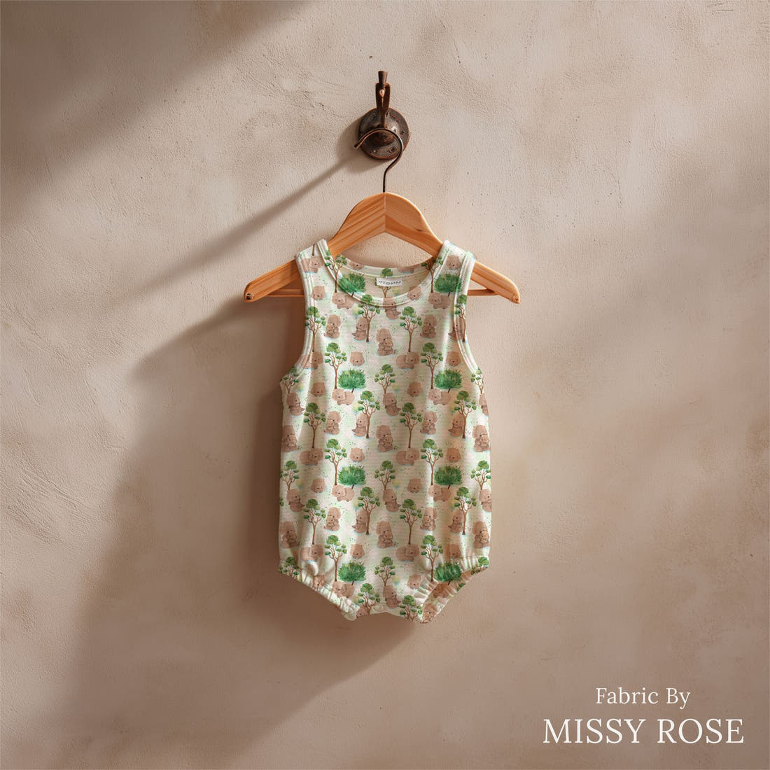 Design 1093 Green Wombat Fabric sewn into a baby romper – see how the print looks made up | Fabric by Missy Rose
