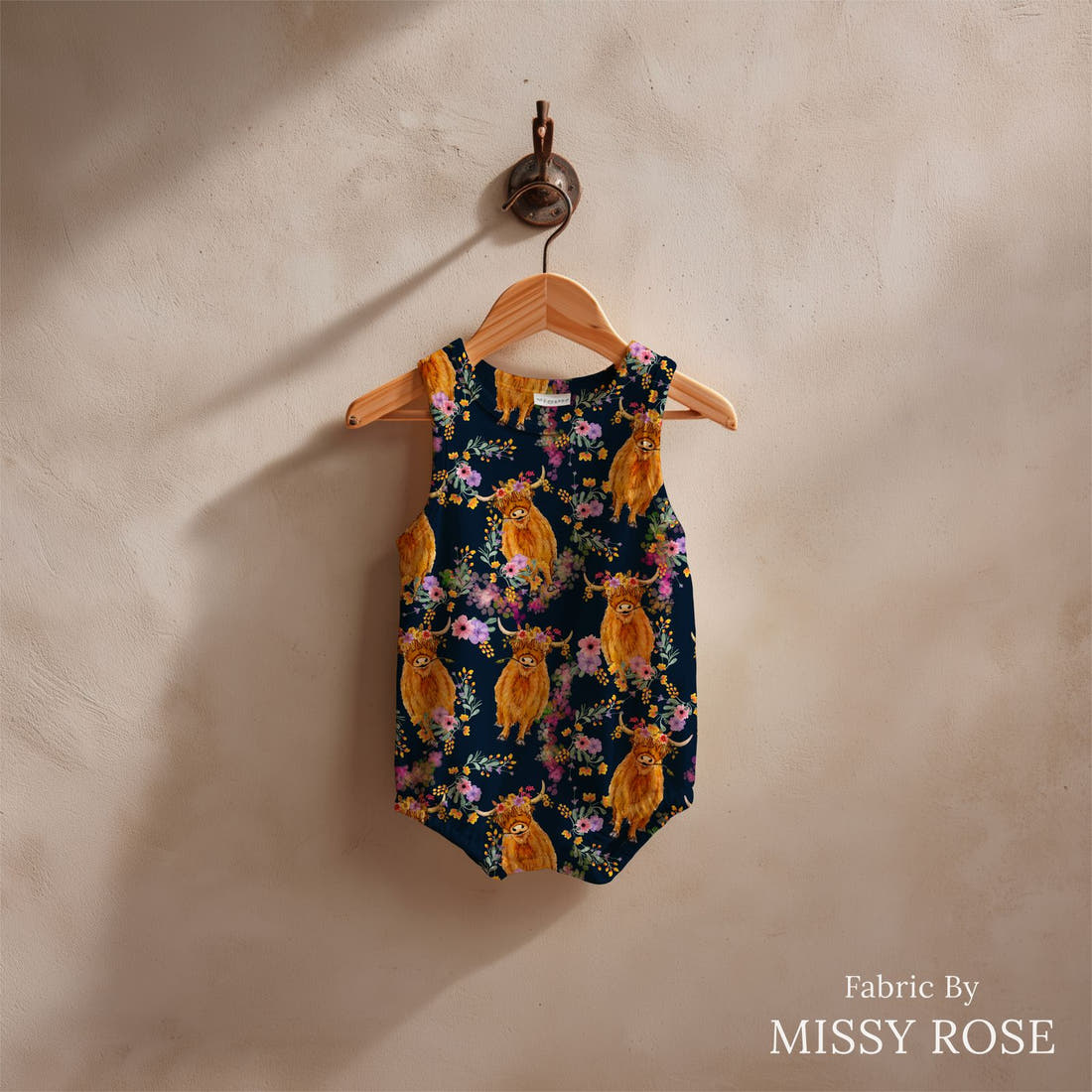Design 113 Navy Highland Fabric sewn into a baby romper – see how the print looks made up | Fabric by Missy Rose