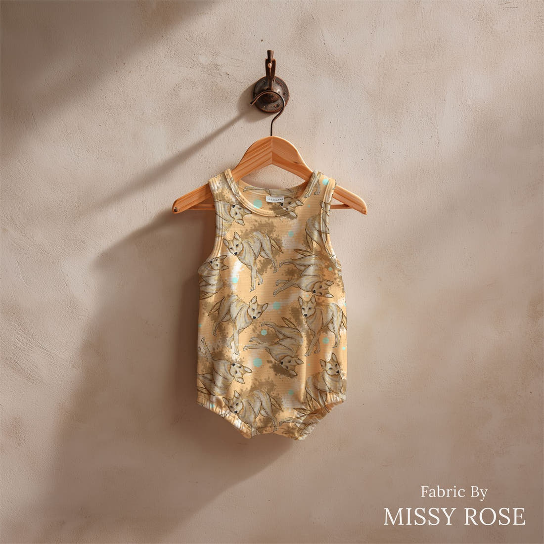 Design 1135 Dingo Fabric sewn into a baby romper – see how the print looks made up | Fabric by Missy Rose