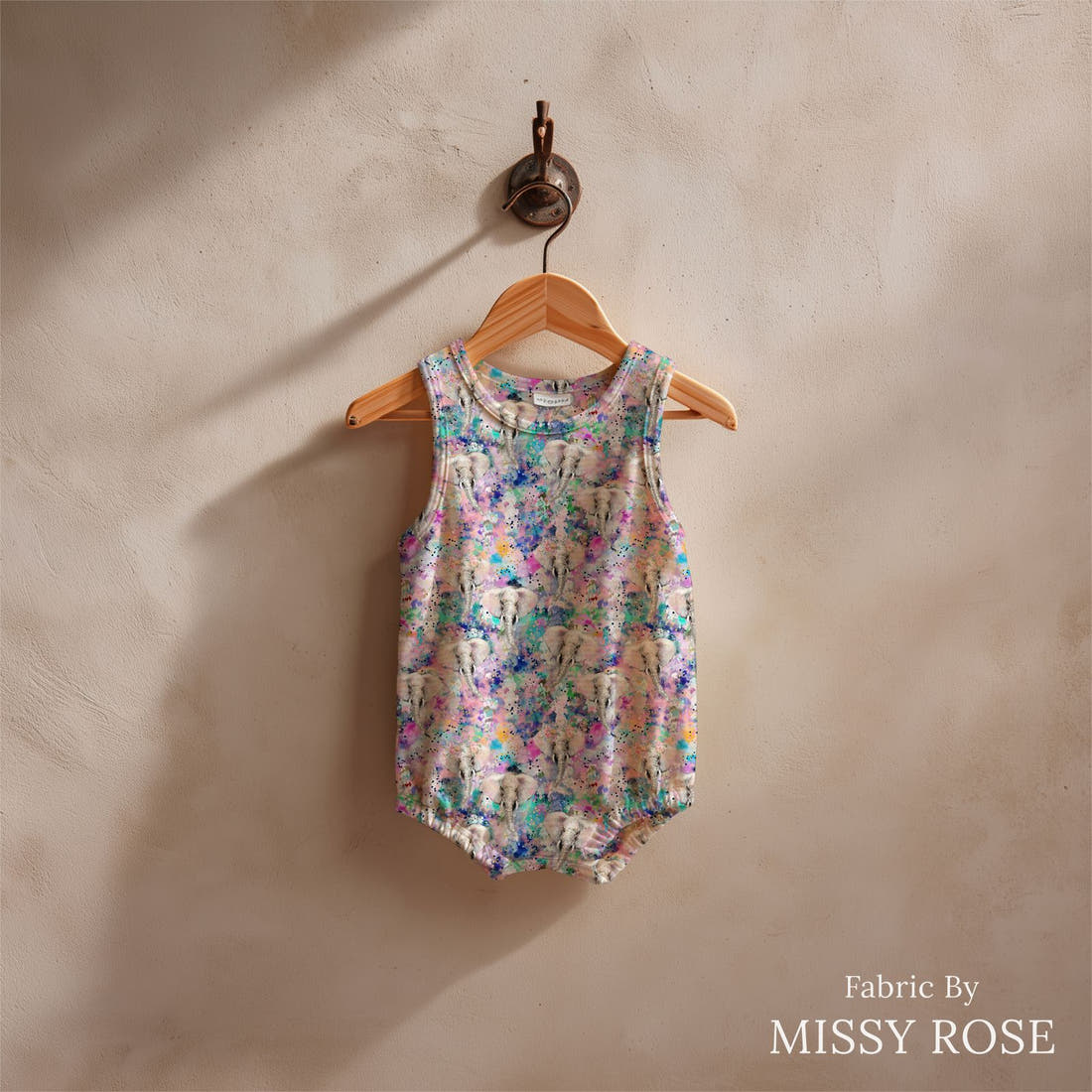 Design 1140 Elephant Fabric sewn into a baby romper – see how the print looks made up | Fabric by Missy Rose