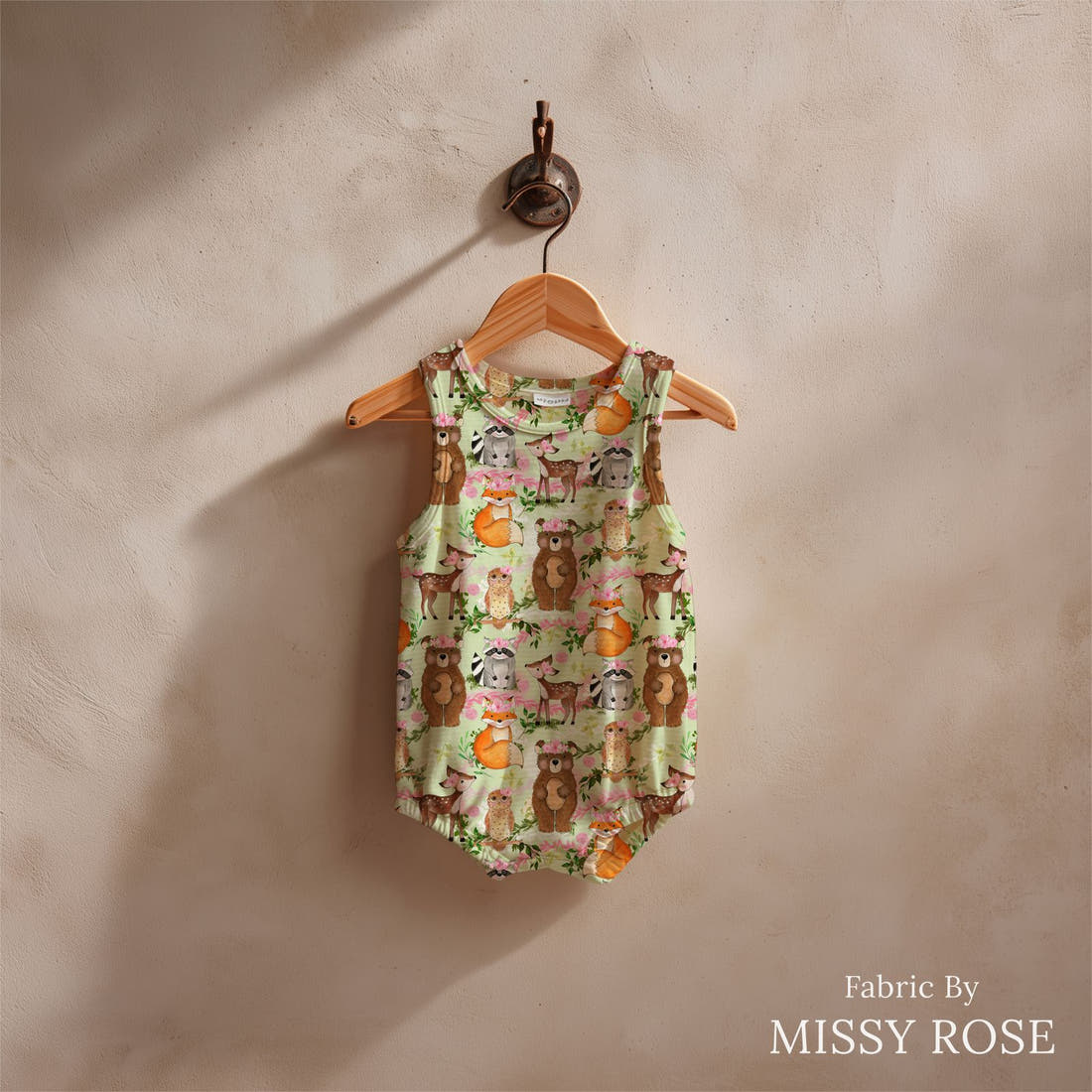 Design 1147 Green Woodlands Fabric sewn into a baby romper – see how the print looks made up | Fabric by Missy Rose