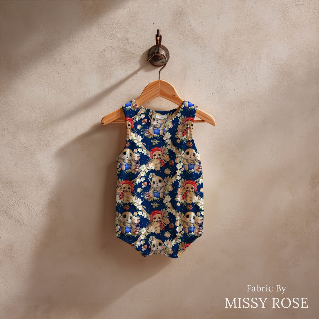 Design 1149 Navy Bunny Fabric sewn into a baby romper – see how the print looks made up | Fabric by Missy Rose