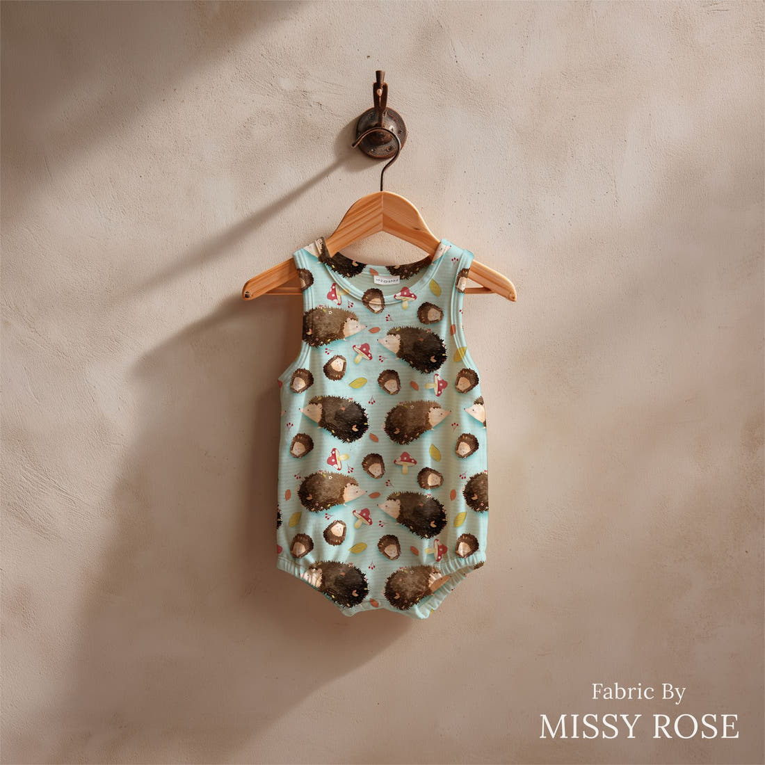 Design 1151 Blue Hedgehog Fabric sewn into a baby romper – see how the print looks made up | Fabric by Missy Rose