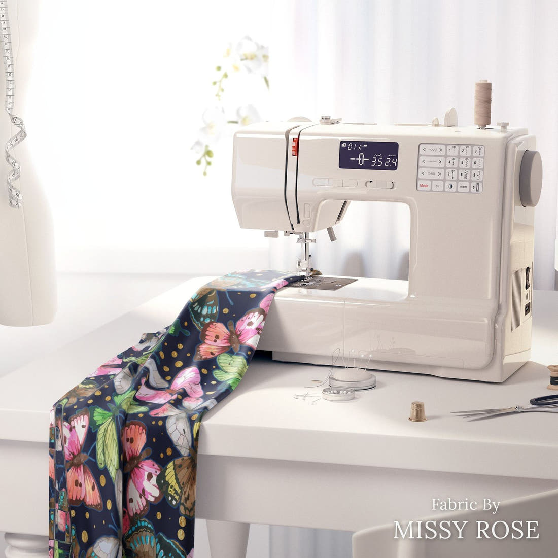 Design 116 Navy Butterfly Fabric on a sewing machine – premium fabric for sewing projects | Fabric by Missy Rose
