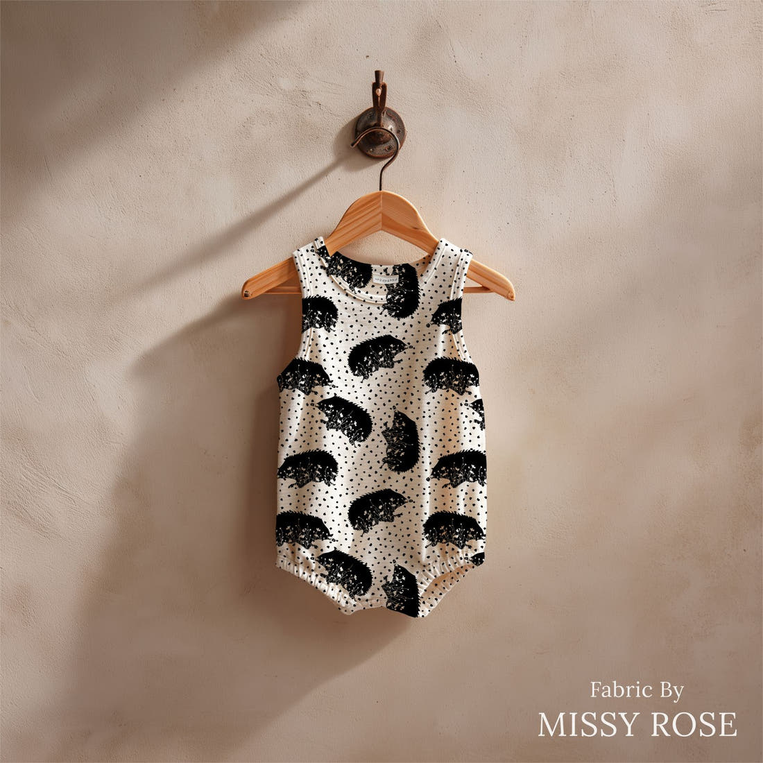 Design 1173 Monochrome Echidna Fabric sewn into a baby romper – see how the print looks made up | Fabric by Missy Rose