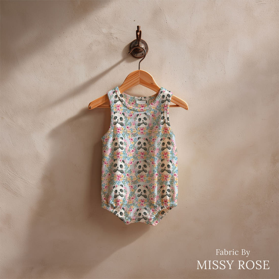 Design 1175 Blue Panda Fabric sewn into a baby romper – see how the print looks made up | Fabric by Missy Rose