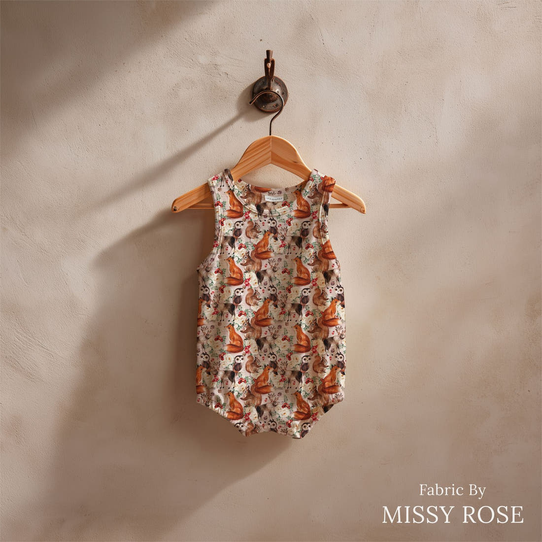 Design 1177 Cute Woodlands Fabric sewn into a baby romper – see how the print looks made up | Fabric by Missy Rose