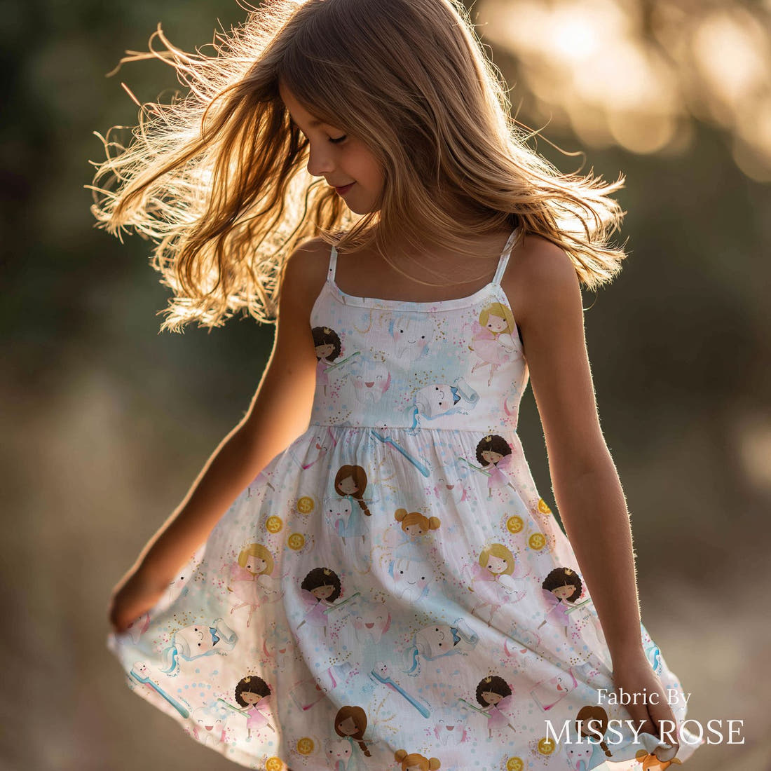 Design 1179 Tooth Fairy Fabric sewn into a girls' dress – see how the print looks made up | Fabric by Missy Rose