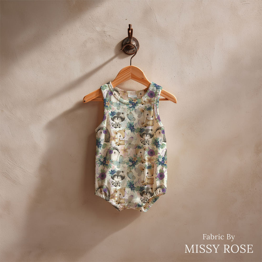 Design 1190 Woodlands Babies Fabric sewn into a baby romper – see how the print looks made up | Fabric by Missy Rose