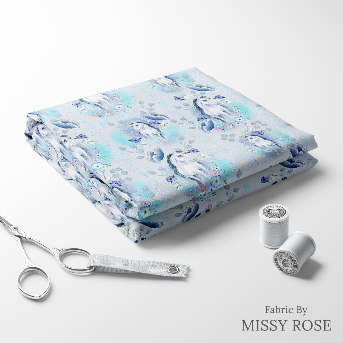 Design 1200 Blue Unicorn Fabric folded fabric stack with matching thread – pre-order fabric Australia | Fabric by Missy Rose