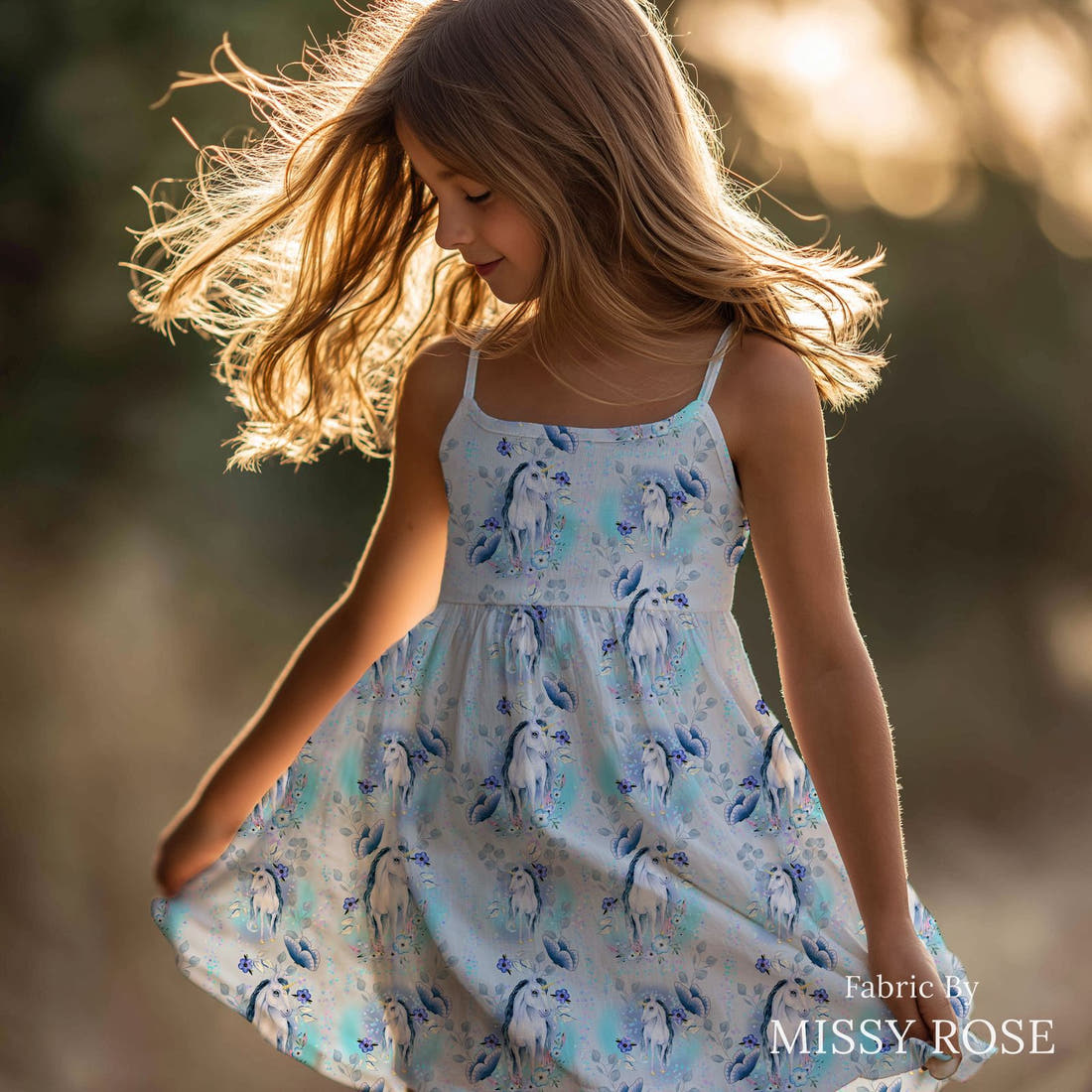 Design 1200 Blue Unicorn Fabric sewn into a girls' dress – see how the print looks made up | Fabric by Missy Rose