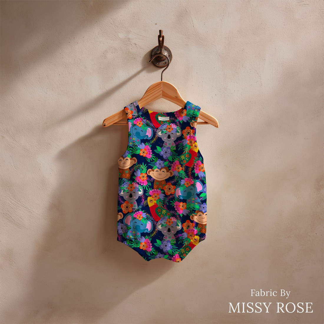 Design 131 Navy Jungle Animals Fabric sewn into a baby romper – see how the print looks made up | Fabric by Missy Rose