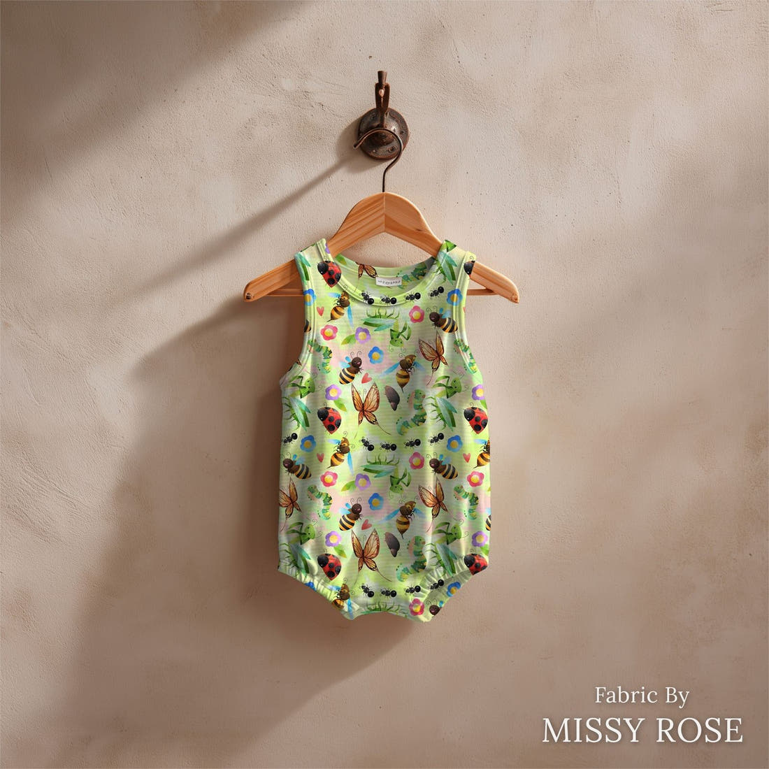 Design 190 Green Bugs Fabric sewn into a baby romper – see how the print looks made up | Fabric by Missy Rose