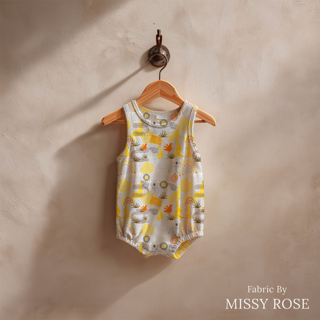 Design 216 Grey Australian Animals Fabric sewn into a baby romper – see how the print looks made up | Fabric by Missy Rose