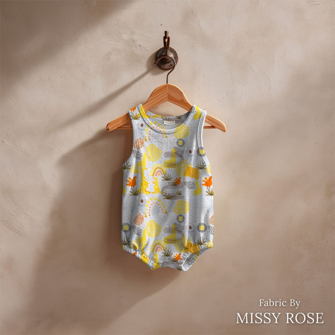 Design 216 Grey Australian Animals Fabric sewn into a baby romper – see how the print looks made up | Fabric by Missy Rose