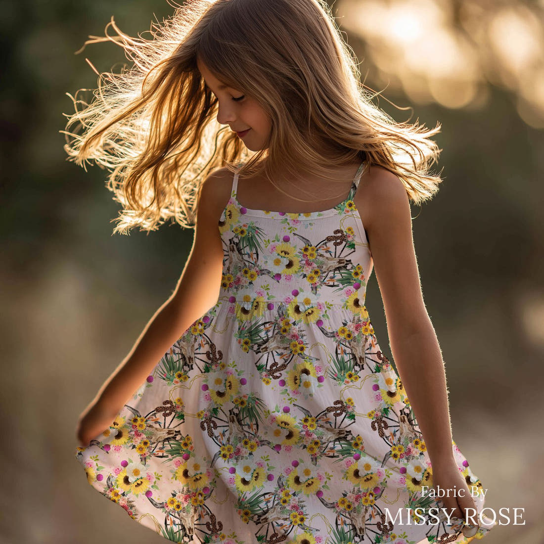 Design 226 Floral Bull Skull Fabric sewn into a girls' dress – see how the print looks made up | Fabric by Missy Rose