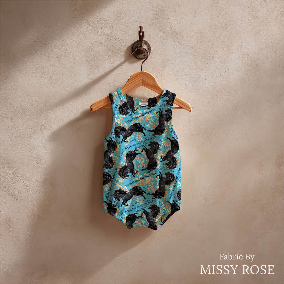 Design 260 Blue Horse Fabric sewn into a baby romper - see how the print looks made up | Fabric by Missy Rose