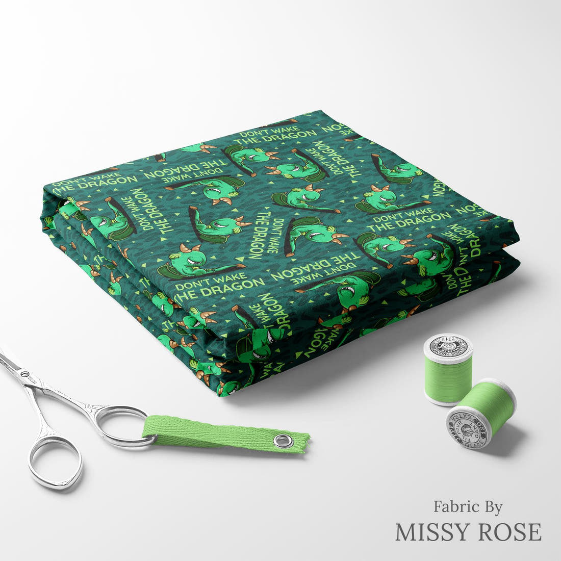 Design 263 Grumpy Dragon Fabric folded fabric stack with matching thread – pre-order fabric Australia | Fabric by Missy Rose