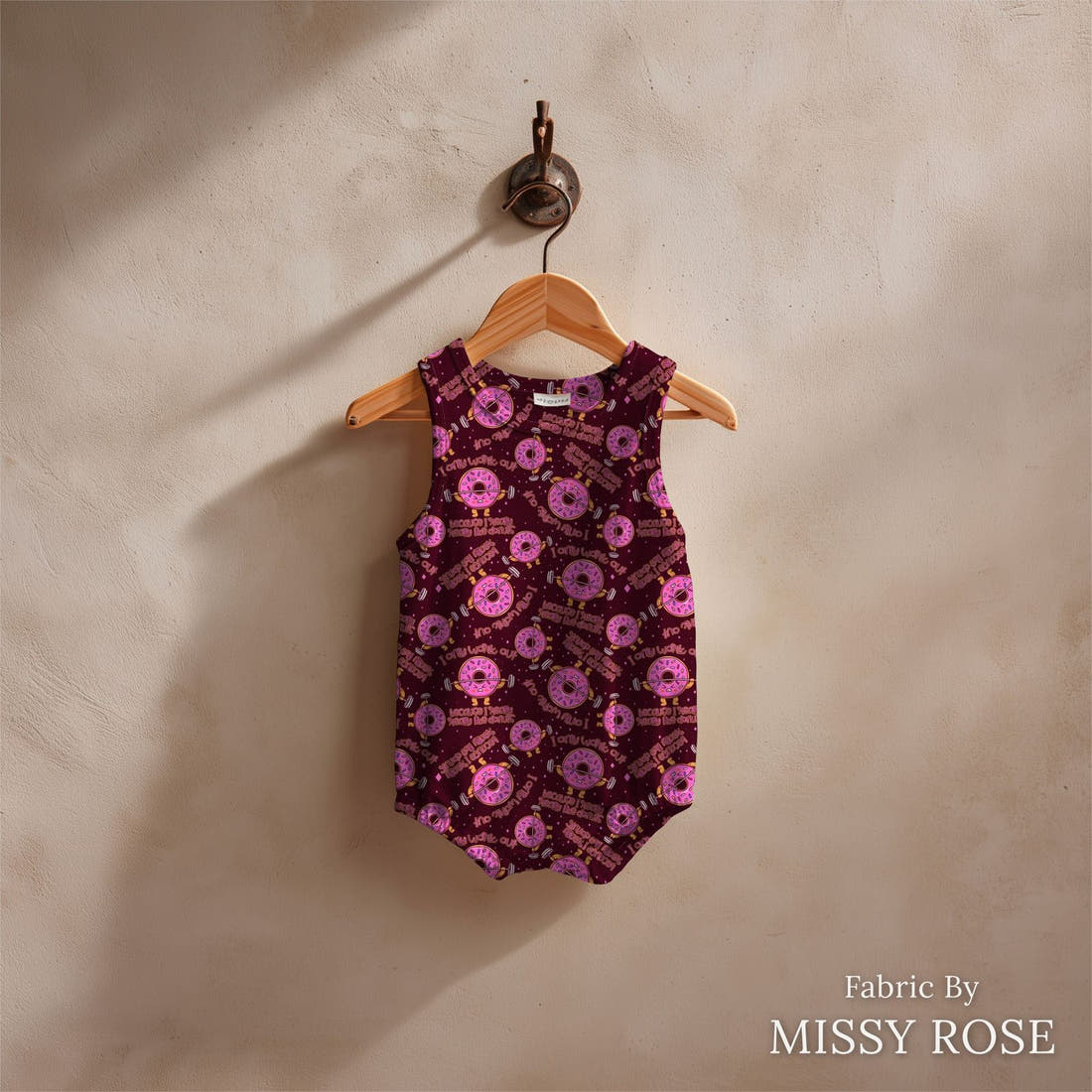Design 268 Donut Fabric sewn into a baby romper – see how the print looks made up | Fabric by Missy Rose