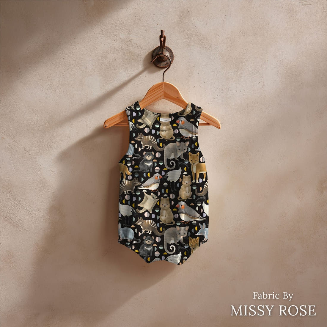 Design 292 Black Australian Animals Fabric sewn into a baby romper – see how the print looks made up | Fabric by Missy Rose
