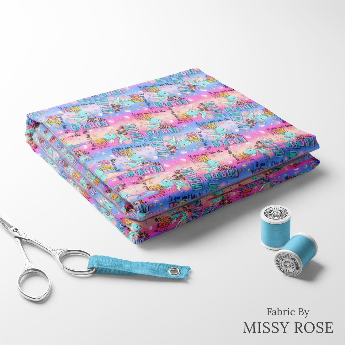 Design 293 Cheeky Dragon Fabric folded fabric stack with matching thread – pre-order fabric Australia | Fabric by Missy Rose