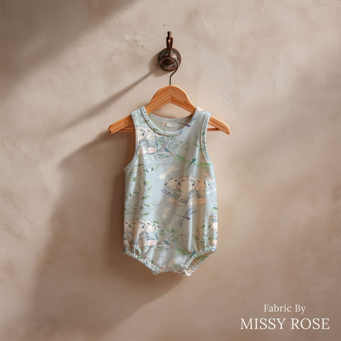 Design 30 Baby Elephant Fabric sewn into a baby romper – see how the print looks made up | Fabric by Missy Rose