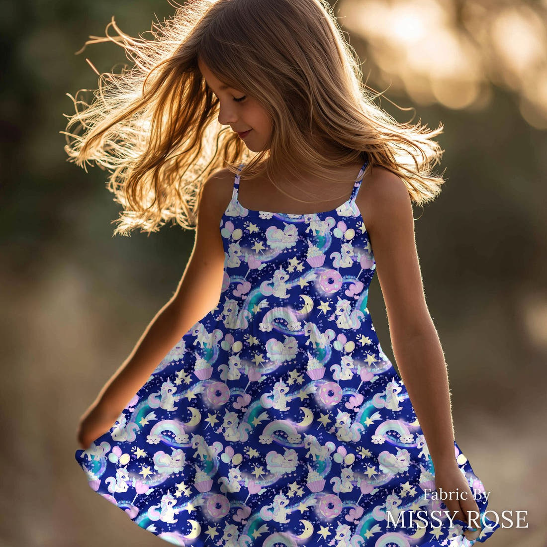 Design 301 Baby Unicorn Fabric sewn into a girls' dress – see how the print looks made up | Fabric by Missy Rose