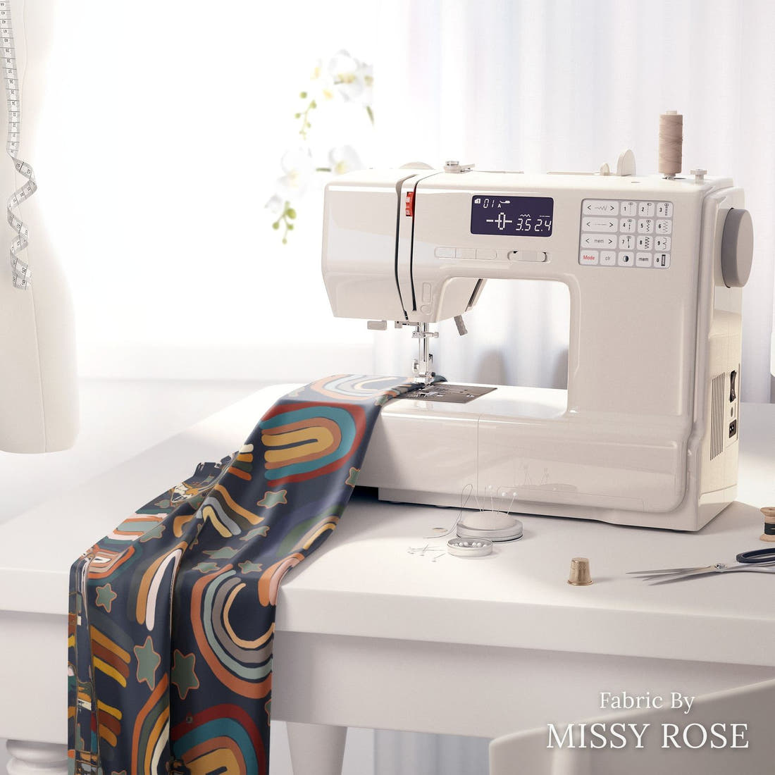 Design 309 Navy Rainbows Fabric on a sewing machine – premium fabric for sewing projects | Fabric by Missy Rose