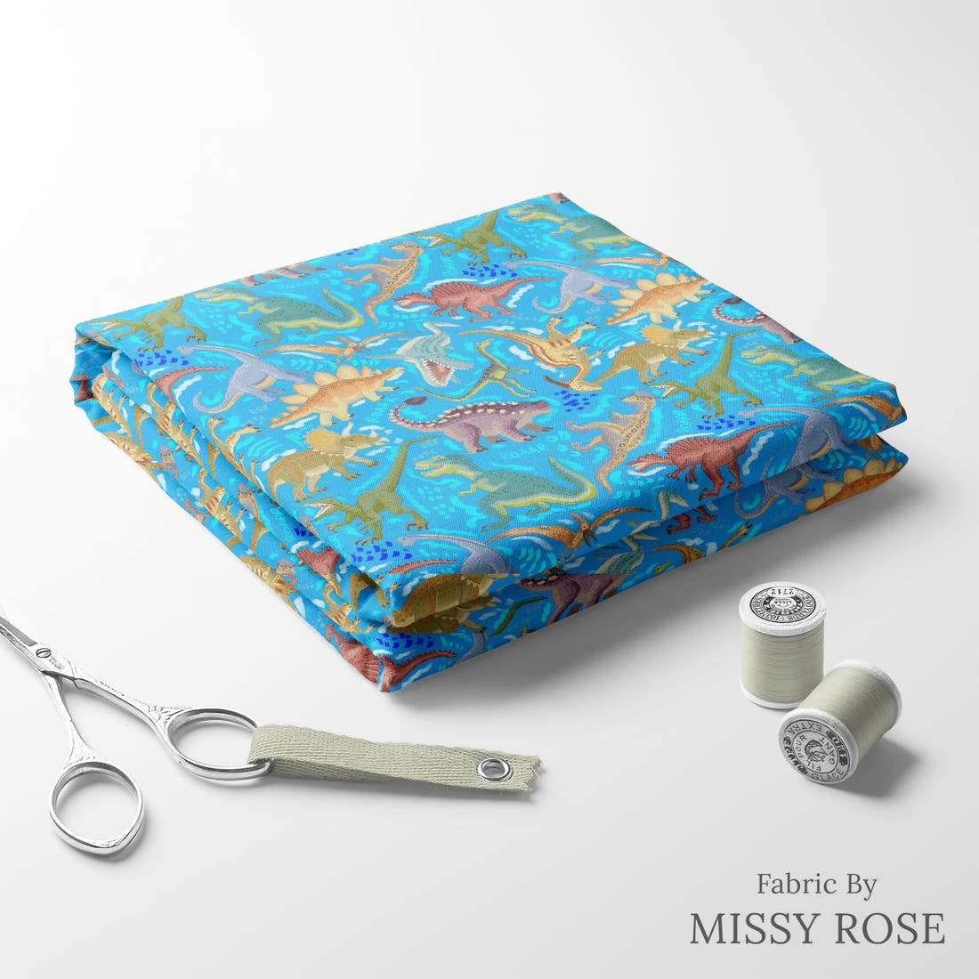 Design 311 Blue Dinosaur Fabric folded fabric stack with matching thread – pre-order fabric Australia | Fabric by Missy Rose