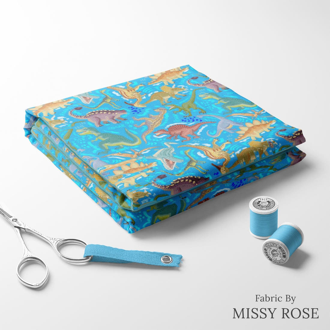 Design 311 Blue Dinosaur Fabric folded fabric stack with matching thread – pre-order fabric Australia | Fabric by Missy Rose