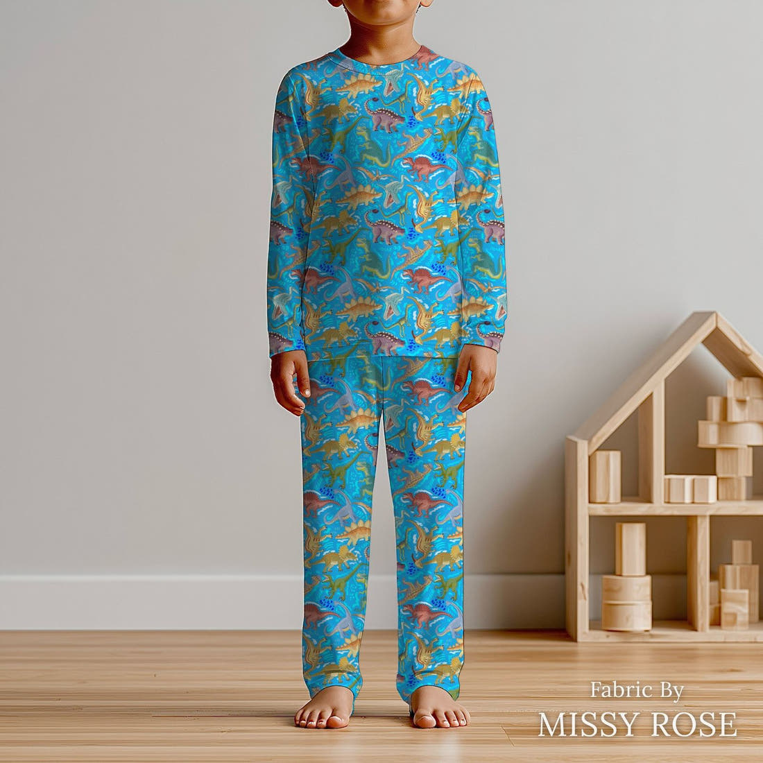 Design 311 Blue Dinosaur Fabric sewn into kids' pyjamas – see how the print looks made up | Fabric by Missy Rose