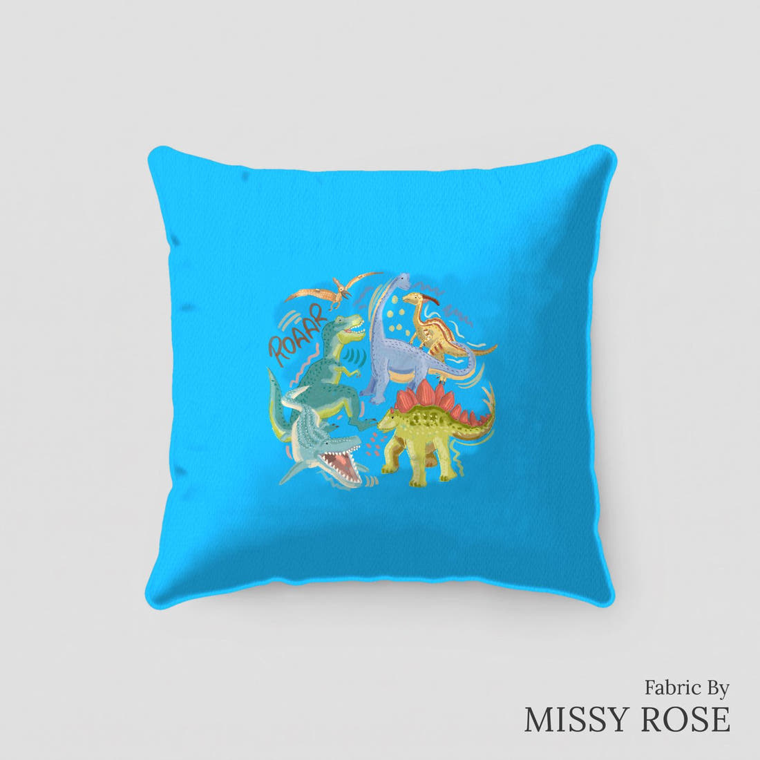 Design 311 Blue Dinosaur Panel sewn into a cushion – see how the panel looks made up | Fabric by Missy Rose