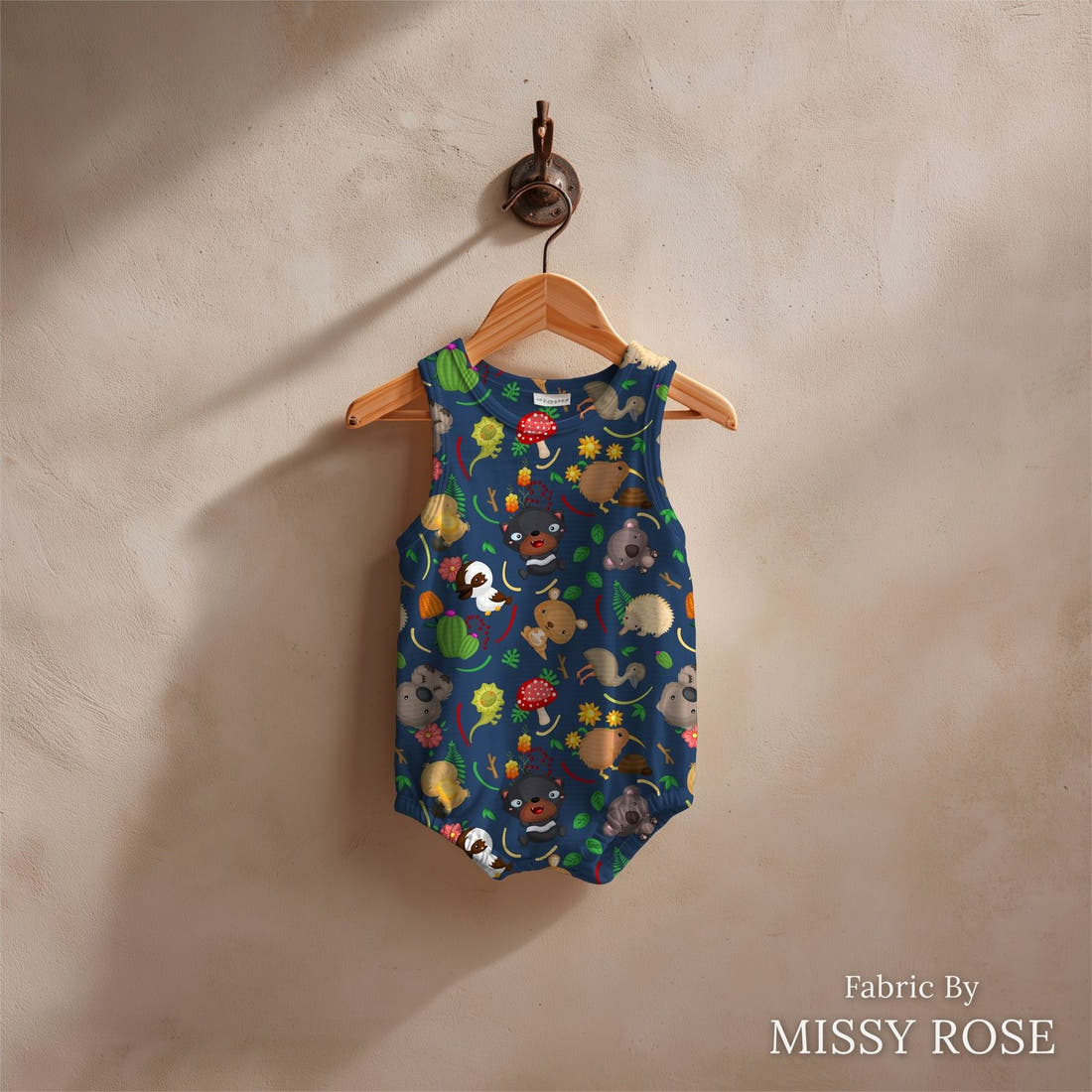 Design 320 Navy Australian Animals Fabric sewn into a baby romper – see how the print looks made up | Fabric by Missy Rose