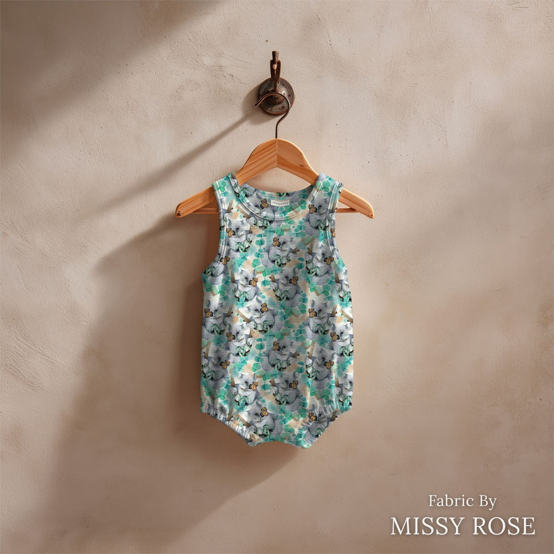 Design 323 Butterfly Koala Fabric sewn into a baby romper – see how the print looks made up | Fabric by Missy Rose