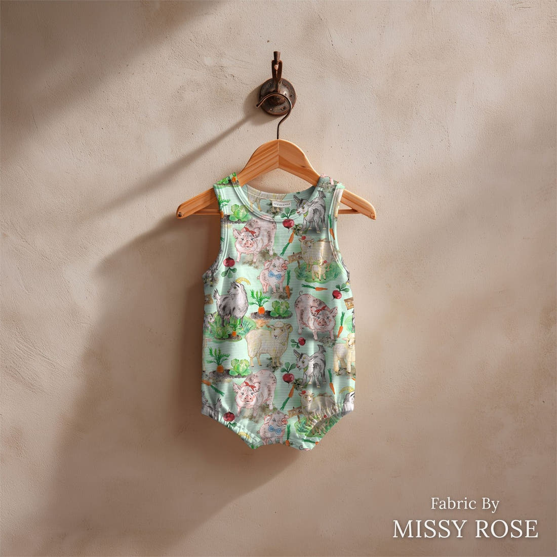 Design 333 Green Farm Animals Fabric sewn into a baby romper – see how the print looks made up | Fabric by Missy Rose