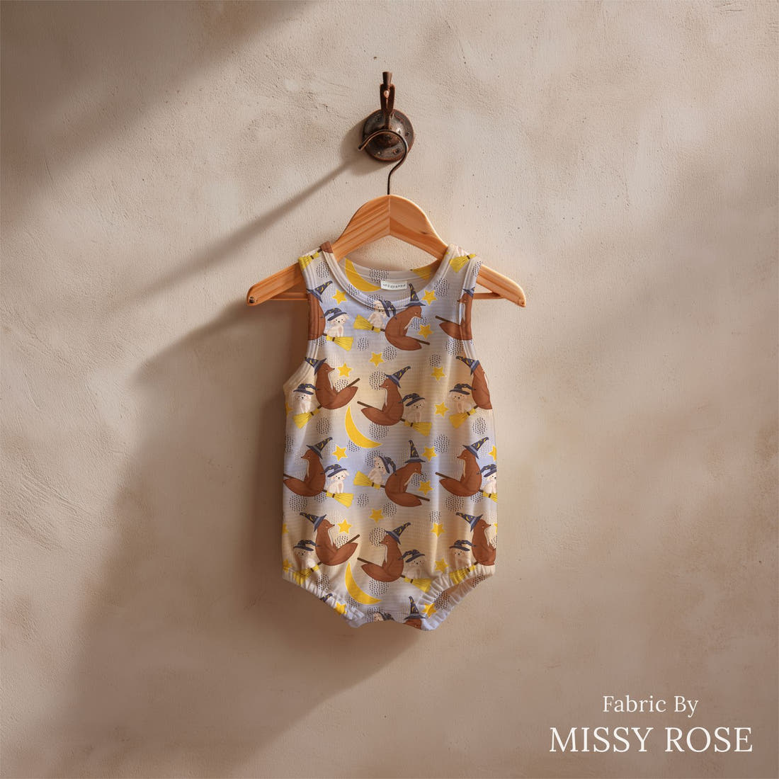 Design 341 Broomestick Animals Fabric sewn into a baby romper - see how the print looks made up | Fabric by Missy Rose