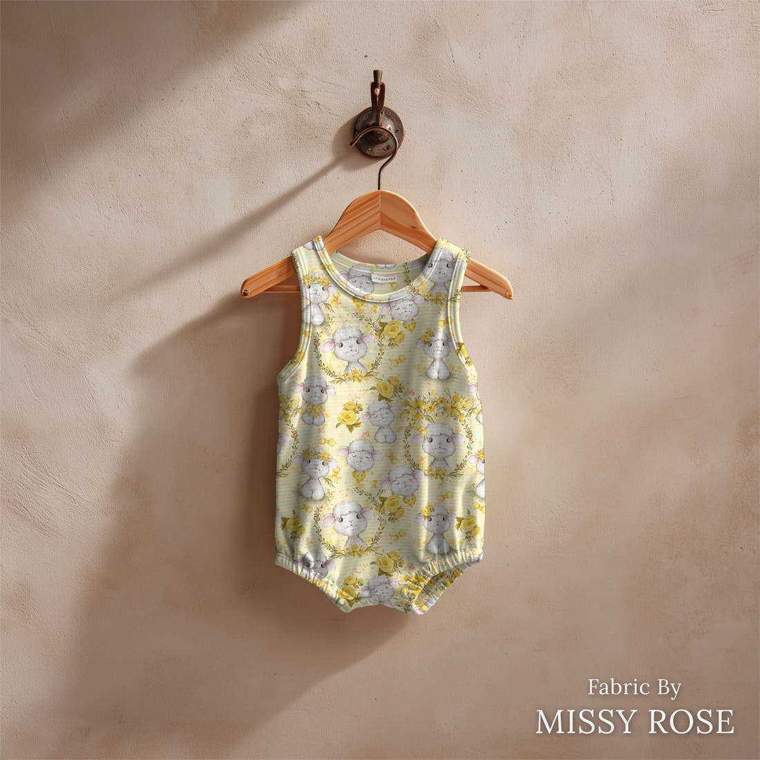 Design 374 Yellow Lamb Fabric sewn into a baby romper – see how the print looks made up | Fabric by Missy Rose