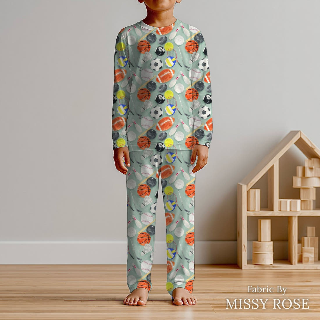 Design 397 Sports Balls Fabric sewn into kids' pyjamas – see how the print looks made up | Fabric by Missy Rose